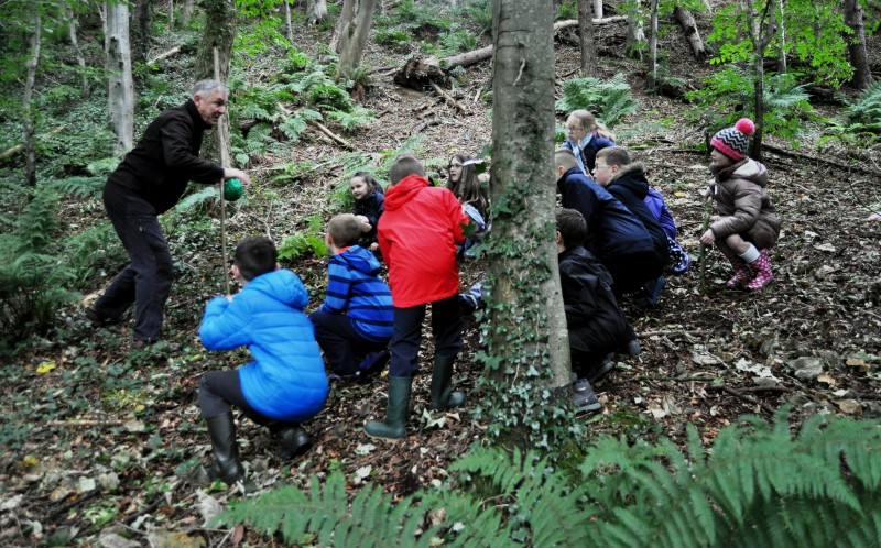 Local facilitator Jim Allen demonstrates hunting techniques to pupils from St Malachy’s Primary School and The Irish Society Primary School in Coleraine.