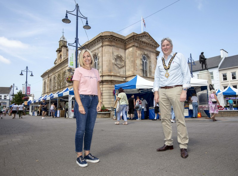 The Mayor of Causeway Coast and Glens Borough Council Councillor Richard Holmes pictured with Lynne Rainey from Angel Wood Candles at Causeway Speciality Market in Coleraine. Lynne is the market’s longest serving trader, and has been a member since the first market was held back in 2006.