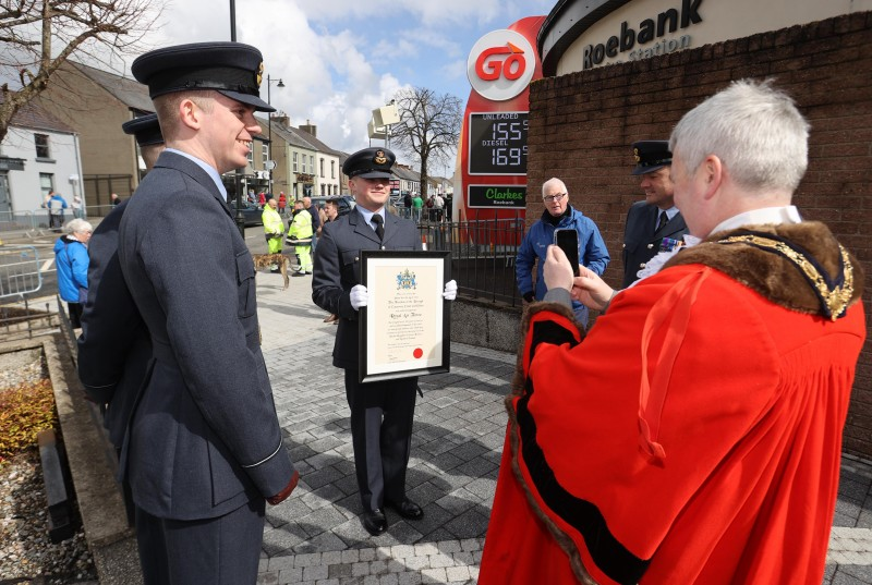 The Mayor takes a moment to get a picture of the Freedom certificate.