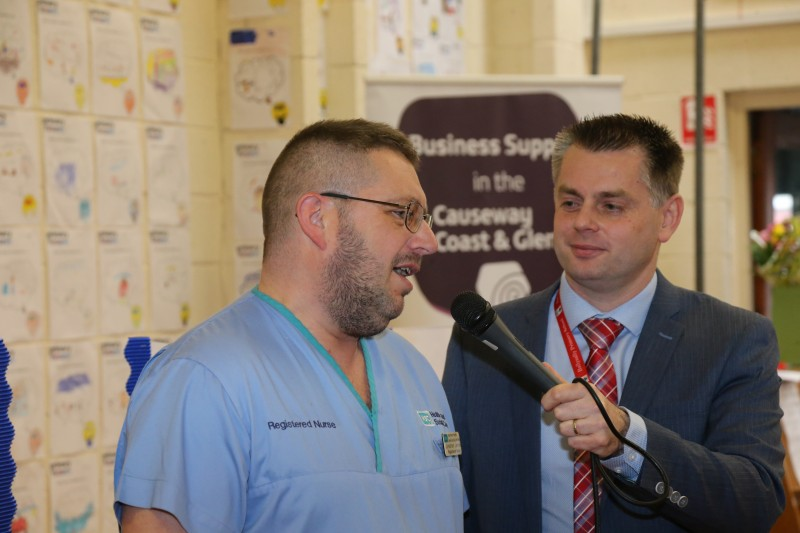 Nurse Jonny Lennox shares his career journey with Principal Geoff Dunn at the special assembly.