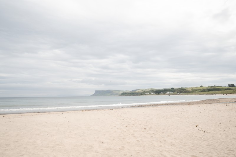 Ballycastle beach and the sea with Fairhead in the distance.