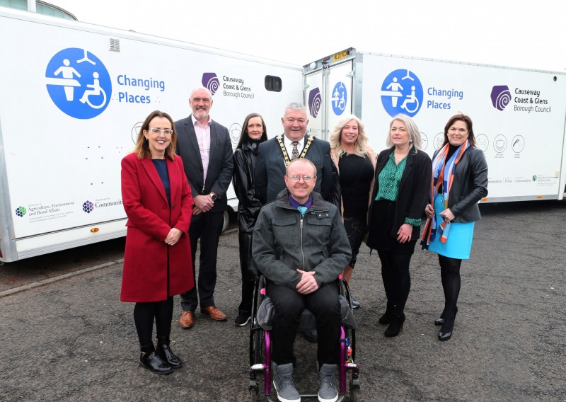 Pictured at Cloonavin with Causeway Coast and Glens Borough Council’s new Mobile Accessible Changing Units are Diversity Champion, Councillor Cara McShane, William Cameron (Department for Communities), Rhonda Williamson (Department for Communities), Elaine McConaghie (Policy Officer), Geraldine Wills (Town and Village Project Officer), Julienne Elliott (Town and Village Project Manager), the Mayor, Councillor Ivor Wallace, and Michael Holden (AccessoLoo Director).