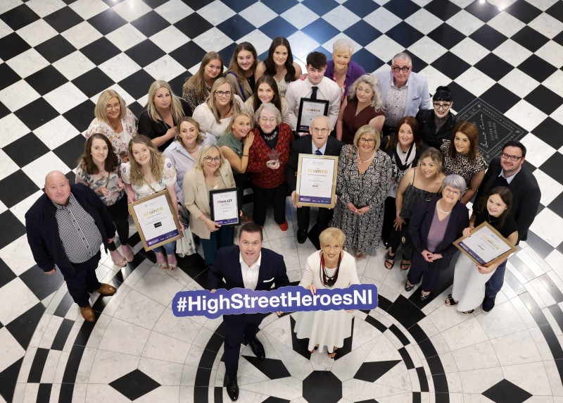 Winners from High Street of the Year Ballymoney, including Winnie Mellett (centre) from The Winsome Lady, Overall Independent Retailer of the Year, pictured with Retail NI CEO Glyn Roberts at Belfast City Hall.