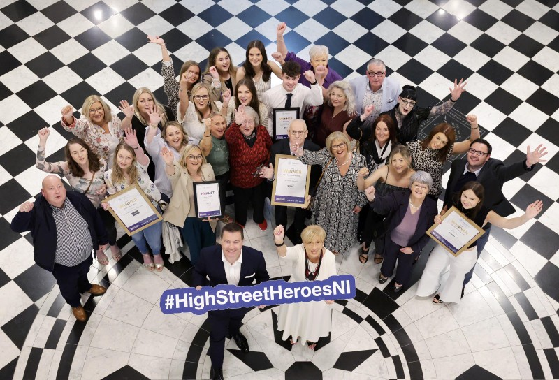 Winners from High Street of the Year Ballymoney, including Winnie Mellett (centre) from The Winsome Lady, Overall Independent Retailer of the Year, pictured with Retail NI CEO Glyn Roberts at Belfast City Hall.
