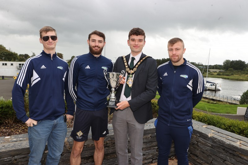 Reece Oliver, Jonny Holland and Brooklyn George, players from the Irish Street League 20th Anniversary International Invitation Tournament, pictured with Mayor of Causeway Coast and Glens, Councillor Ciarán McQuillan at a reception held to celebrate their success in Dublin.