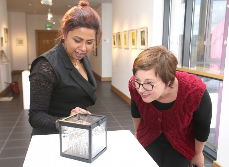 Guests admire some of the pieces included in the Marankal exhibition.