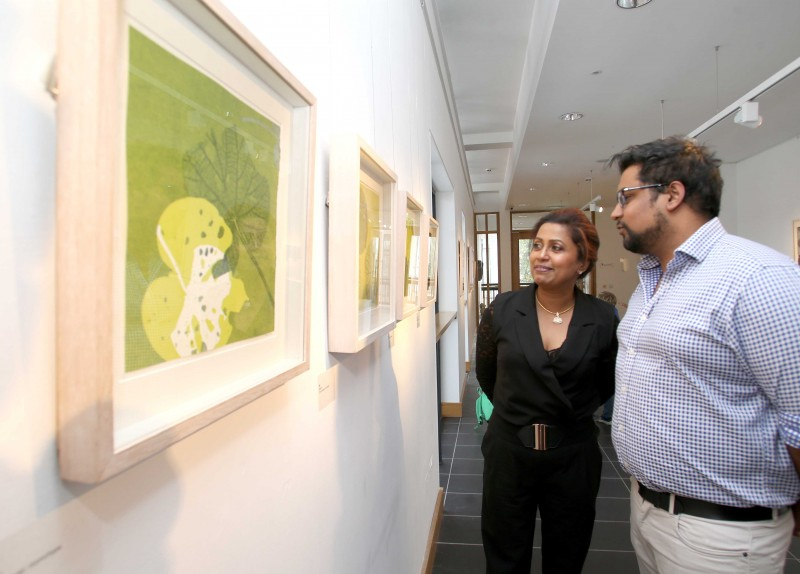 Artist Anushiya Sundaralingam pictured with guests at the opening of her Marankal exhibition at Roe Valley Arts and Cultural Centre.