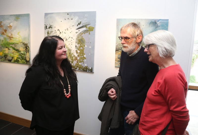 Desima Connolly from Causeway Coast and Glens Borough Council pictured with visitors at the Over Nature exhibition launch.