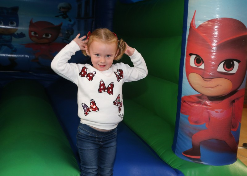 Enjoying the bouncy castle at the Community Engagement event.