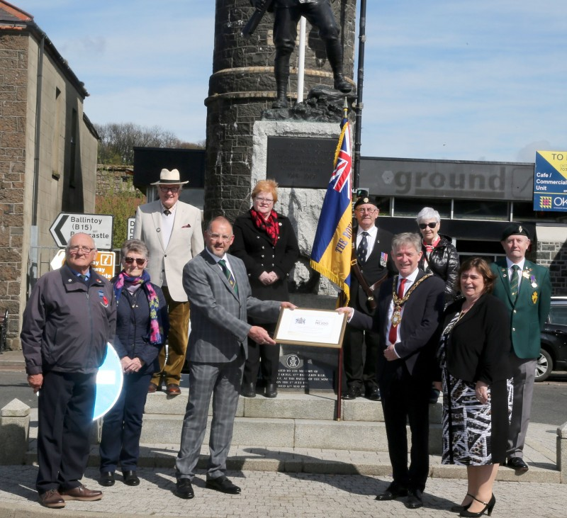 Members of Bushmills Royal British Legion receive a framed centenary certificate from the Mayor of Causeway Coast and Glens Borough Council Alderman Mark Fielding and Mayoress Mrs Phyliss Fielding.