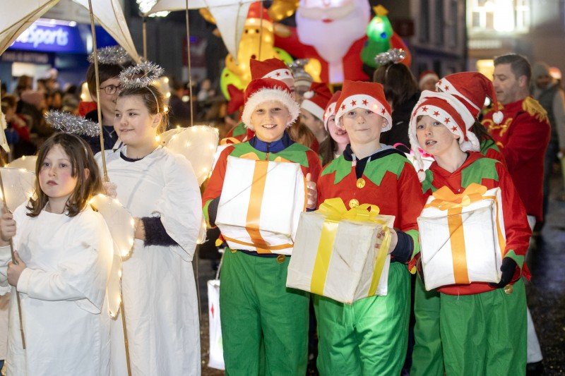 A group of children dressed as angels and elves taking part in the festive parade at the Christmas Light Switch On event in Ballymoney.