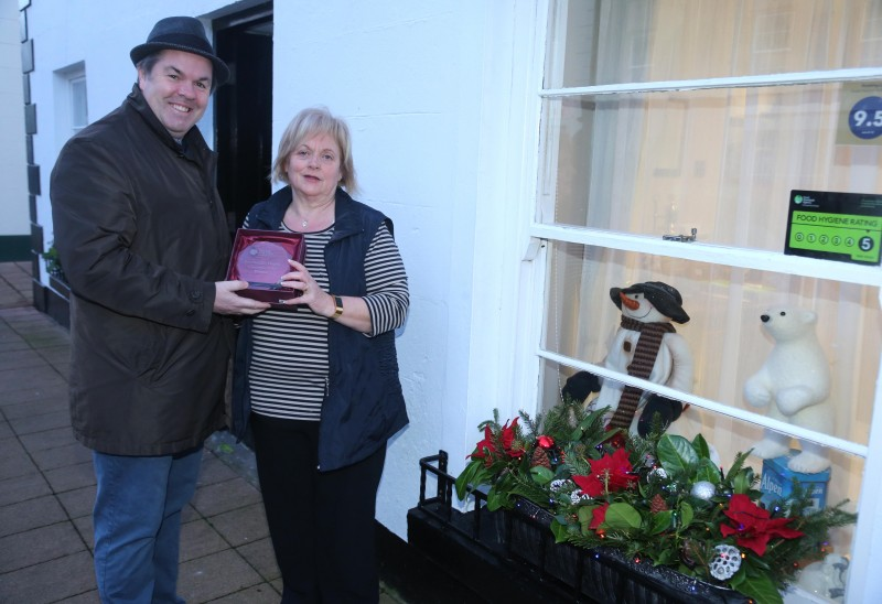 Riverside B&B on Mill Street Cushendall was the winner of the Causeway Coast and Glens Borough Council’s Christmas window competition in Cushendall. Anne McKeegan is pictured receiving the award from Town and Village Officer Shaun Kennedy.