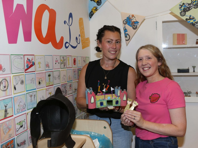 Facilitators, artist Julie-Anne Richmond and Museum Officer, Jamie Austin pictured with some of the crafts the children were creating, alongside a 17th century Burgonet helmet which inspired the theme of Knights, Castles and Princesses.