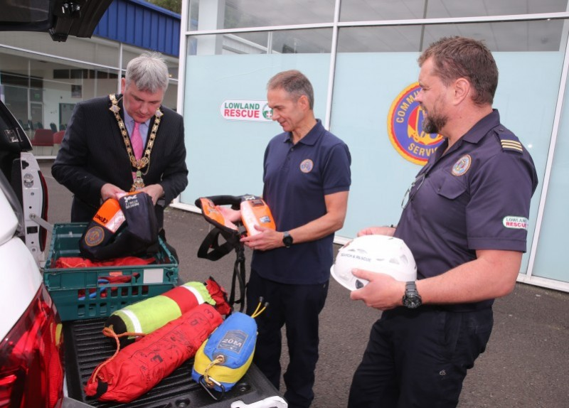 The Mayor of Causeway Coast and Glens Borough Council Councillor Richard Holmes learns more about the work of the Community Rescue Service from Barry Torrens, District Commander and Gregg Smyth, assistant Unit Commander.