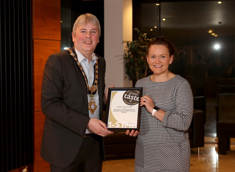 The Mayor of Causeway Coast and Glens Borough Council Councillor Richard Holmes pictured with Great Taste Award winner Lisa Bailey from North Coast Chocolates.
