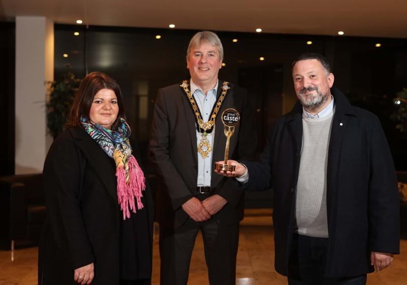 The Mayor of Causeway Coast and Glens Borough Council Councillor Richard Holmes pictured with Great Taste Award winners Daniella and Arnaldo Morelli from Morelli’s ice-cream.