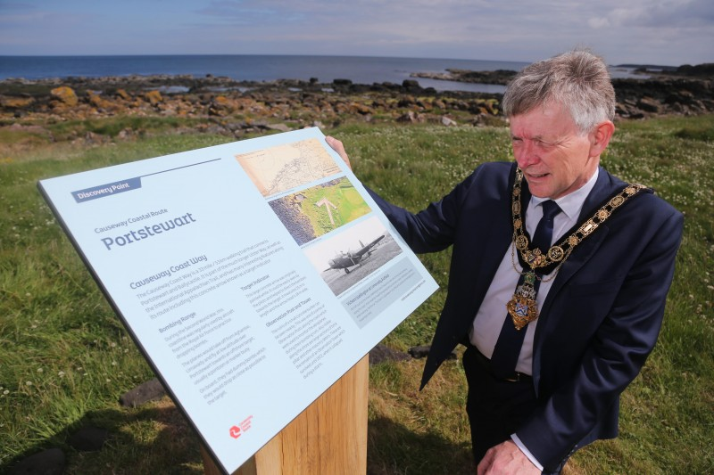 The Mayor of Causeway Coast and Glens Borough Council Alderman Mark Fielding looks at the new information panel at the site of the World War II arrow.