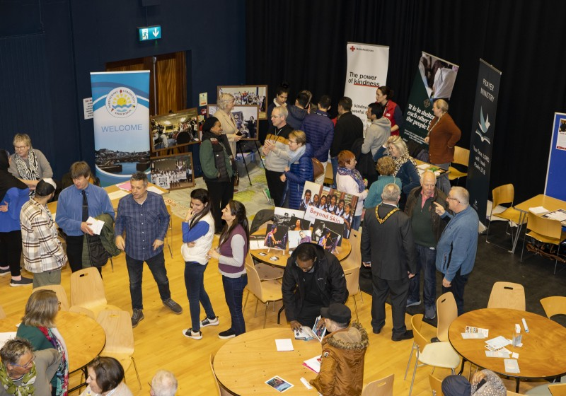Participants at the event share information and get to know each other.