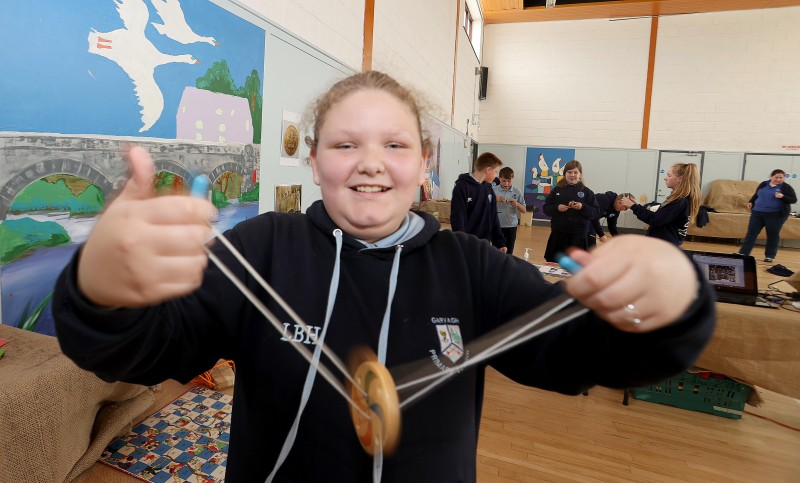 Trying out one a wooden spinner during the Platinum Jubilee schools’ workshop organised by Causeway Coast and Glens Borough Council’s Museums Service.