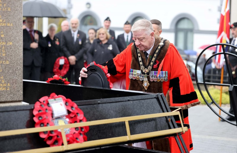 Mayor, Councillor Steven Callaghan lays a wreath at the Remembrance Day service at Limavady War Memorial.