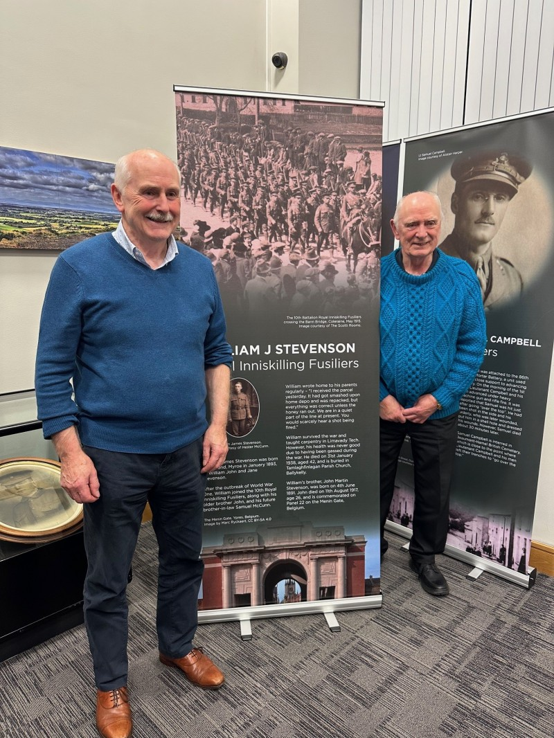 Members of the Stevenson family pictured with the exhibition panel on their relative Private William J Stevenson.