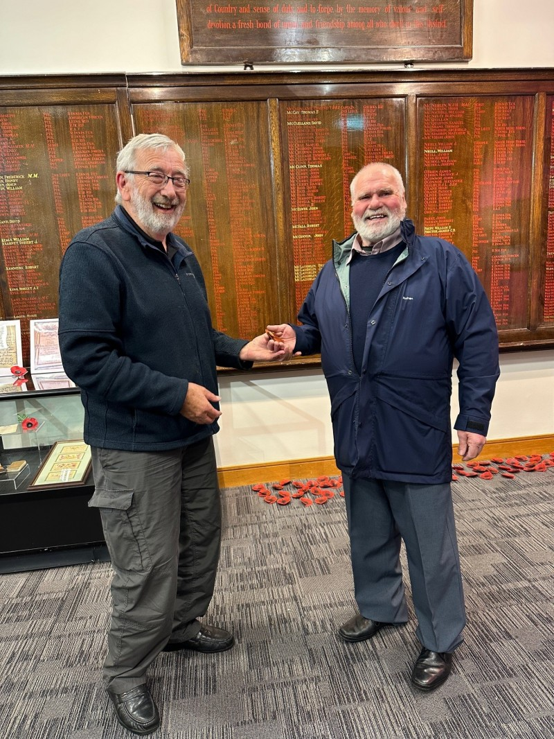 Robert Peacock, who had previously been given Private Joseph Warke’s British War Medal during his research on the Warke family, presenting the medal to Robert Warke, a representative of the family.