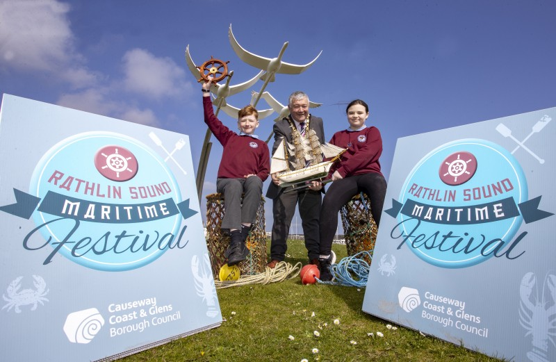 Mayor of Causeway Coast and Glens, Councillor Ivor Wallace with Riley Morris and Maia Kinney, Head Boy and Head Girl at Ballycastle Integrate PS, at the launch of Rathlin Sound Maritime Festival