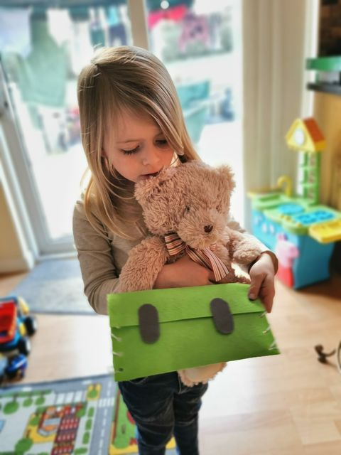 Layla, age 4 with her portrait stamp and postcard created as part of ‘From me to you- A journey of a postcard’, which saw children explore the journey of one little Bear’s postcard to his Granda Bear