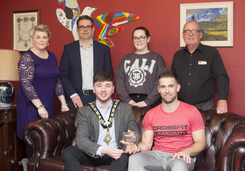 Michael Walsh, winner of the 35-39 age group category at the International Functional Fitness Federation- IF3 World Championships in Australia, pictured with the Mayor of Causeway Coast and Glens Borough Council, Councillor Sean Bateson and family members at a recent reception to celebrate his success.