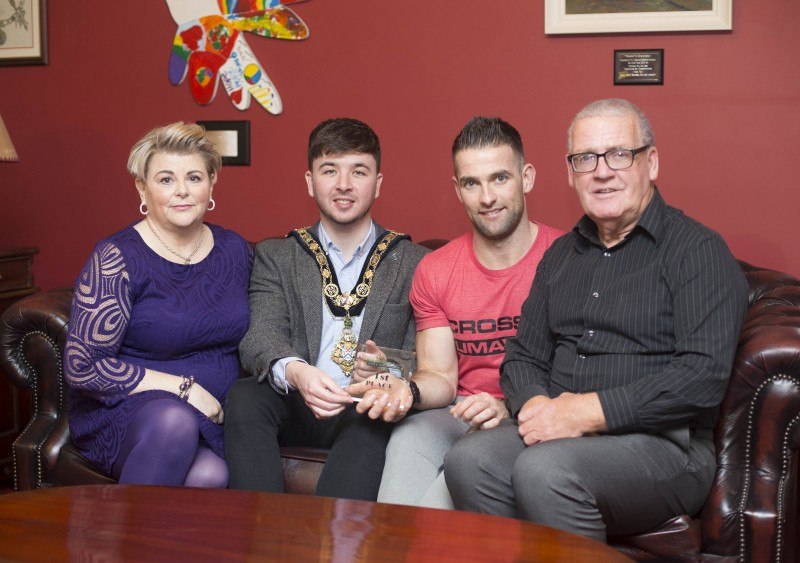 The Mayor of Causeway Coast and Glens Borough Council Councillor Sean Bateson recently hosted a reception for Michael Walsh who took 1st place at the International Functional Fitness Federation- IF3 World Championships in Australia, within the 35-39 age group category. Included in the picture are Michael’s mother Christine and father Jessie.