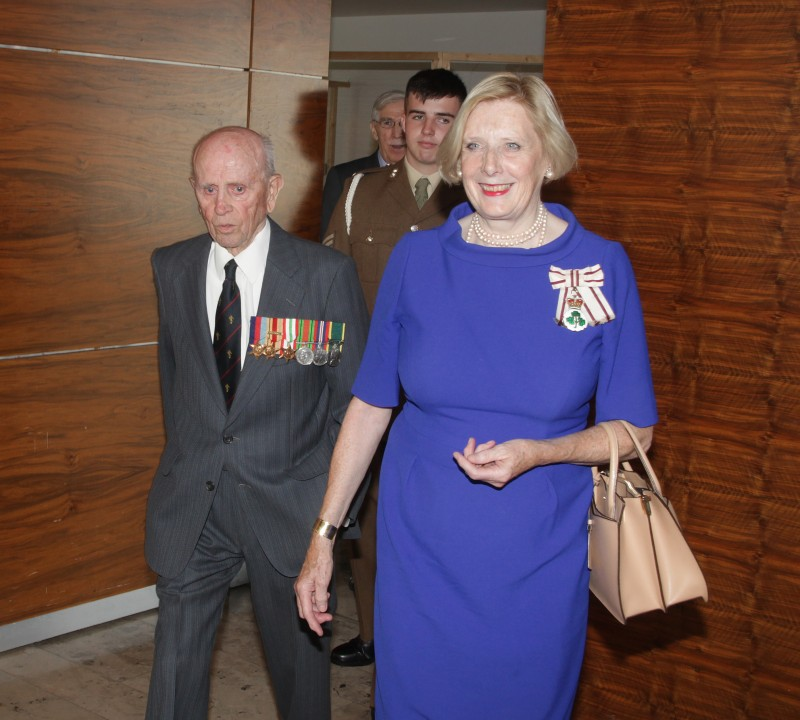 The Lord Lieutenant of County Londonderry, Mrs Alison Millar, leads Norman Irwin into the event held in his honour in Cloonavin.
