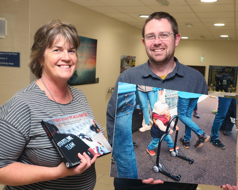 Susan Shepherd, one of the People’s Choice winners in this year’s ‘Capture the Moment’ International NW 200 photography competition pictured with Dr Nicholas Wright, Museum Service Community Engagement Officer.