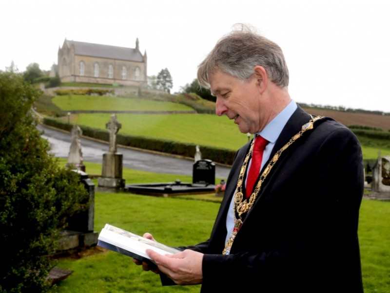 The Mayor of Causeway Coast and Glens Borough Council Alderman Mark Fielding looks through his copy of The Search For Molly: An Irishwoman in the Great War 1914-1918.​