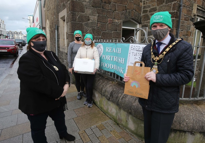 The Mayor of Causeway Coast and Glens Borough Council, Alderman Mark Fielding and his wife Phyllis join Reach volunteers Annette Ludlow and Jo Purcell at their Portrush base as they get ready to deliver food and essential items to those in need.