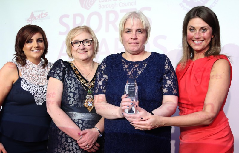 Lisa Christie, who accepted the Sports Administrator of the Year award on behalf of Mary McGoldrick, pictured with the Mayor of Causeway Coast and Glens Borough Council Councillor Brenda Chivers, awards host Sarah Travers and a representative of awards sponsor Grafton Recruitment.