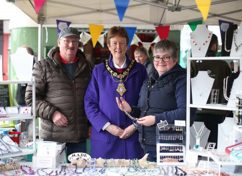 The Mayor of Causeway Coast and Glens Borough Council, Councillor Joan Baird OBE, pictured with Ann and Jim Caldwell at their stall at Naturally North Coast and Glens Artisan Market in Castlecroft Square.