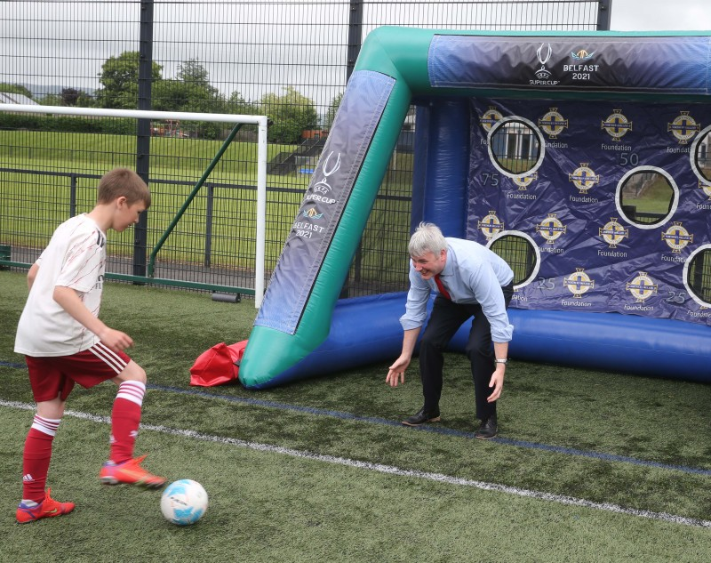 Mayor of Causeway Coast and Glens Borough Council, Councillor Richard Holmes shows off his skills with young players at the football camp at Scroggy Road.