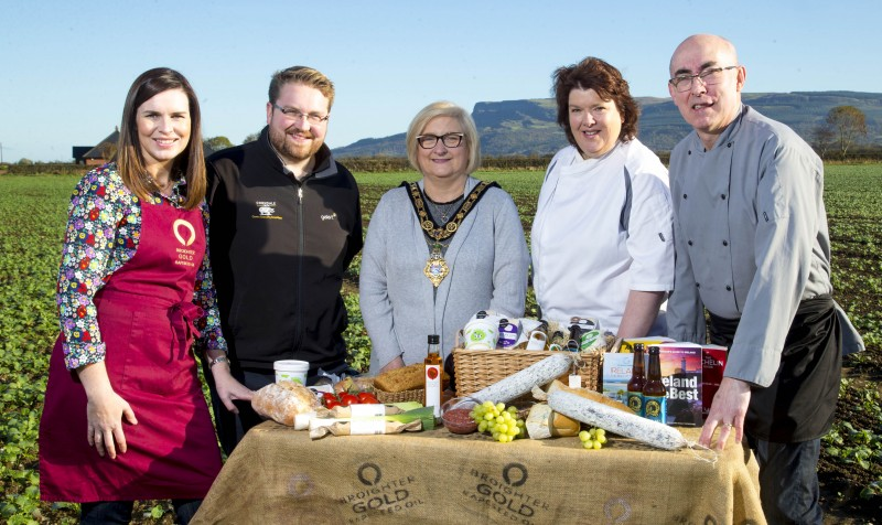 The beautiful Binevenagh mountain provided the background for the launch of Taste Causeway, a new culinary celebration taking place across the Causeway Coast and Glens from November 10th - 18th. L-R Leona Kane, Broighter Gold pictured on the family farm with Alastair Crown from Corndale Farm, the Mayor of Causeway Coast and Glens Borough Council Councillor Brenda Chivers, local food ambassador Paula McIntyre and chef Stanley Matthews from The Lime Tree Restaurant in Limavady.