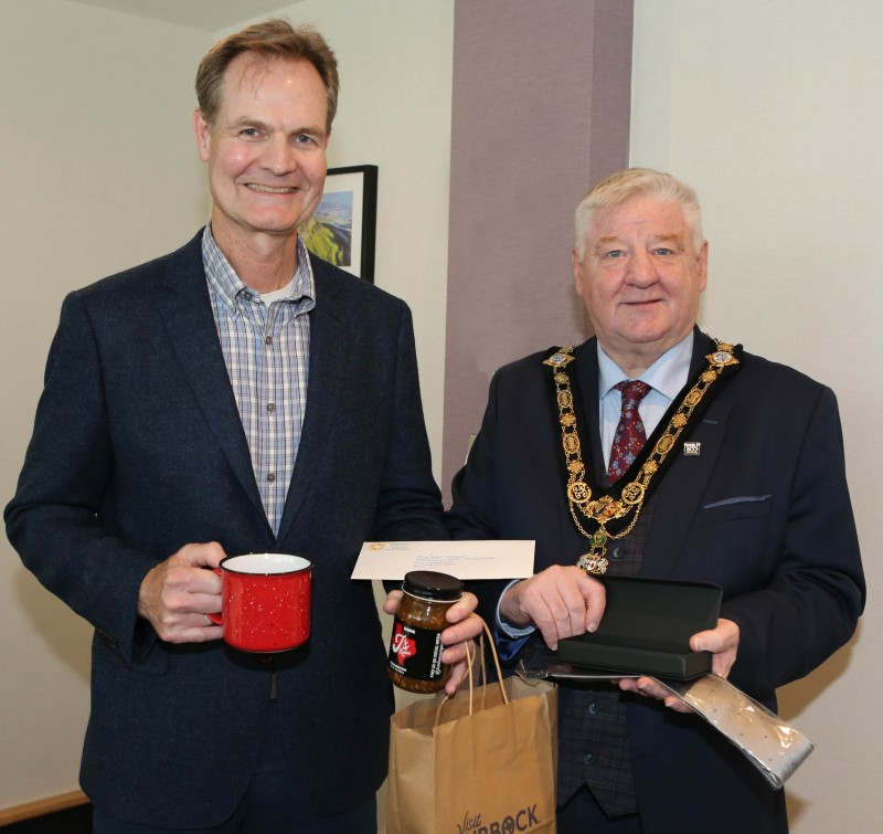 Mayor, Councillor Steven Callaghan receives a gift from Prof Philip Camp, Lubbock Christian University Choral Director.