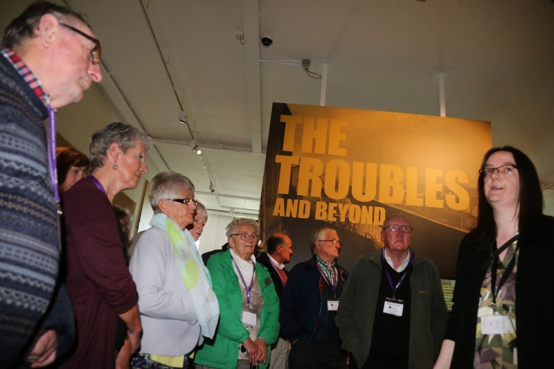Looking at some of the murals in the exhibition.