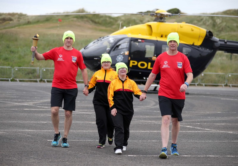 The Flame of Hope arrives in Portrush with members of the Law Enforcement Torch Run and Special Olympics athletes.