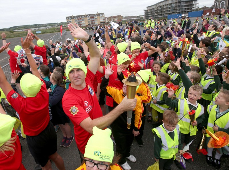 A huge crowd turned out at East Strand in Portrush to welcome the Flame of Hope.