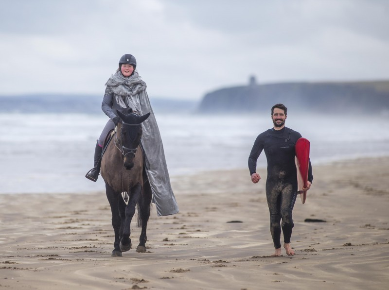 Benone Beach provides the breath-taking backdrop as horse rider Hannah Patterson from Crindle Stables and surfer Dan Lavery from Long Line Surf School help to launch the new 'Out and About in the Causeway Coast and Glens' campaign which runs from March 23rd - 30th.