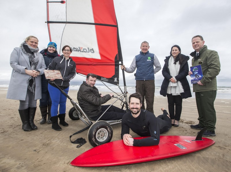 Patricia Deighan from the Angler's Rest in Benone, Hazel Patterson from Crindle Stables, Geri Martin, The Chocolate Manor, Councillor George Duddy, Causeway Coast and Glens Borough Council, George Brien from Blokart Fun, Sinead McNicholl from Roe Park Resort, Ray Bole from Dalriada Kingdom Tours and Dan Lavery from Long Line Surf School help to launch the new 'Out and About in the Causeway Coast and Glens' campaign at Benone Beach.
