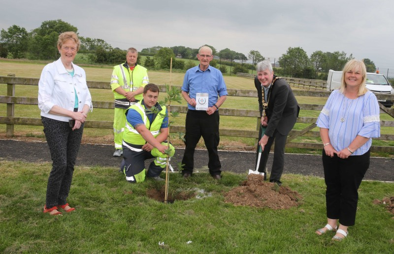 Daniel Simpson from The Clodders pictured with the Mayor of Causeway Coast and Glens Borough Council, Councillor Richard Holmes, Councillor Joan Baird, Councillor Margaret Anne McKillop, and Council staff at the tree planting event in Mosside.