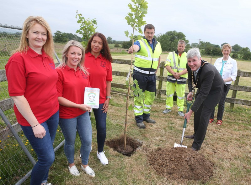 Rhonda Milligan, Elaine King, Elaine Reilly representing Seesaw Playgroup pictured with the Mayor of Causeway Coast and Glens Borough Council Councillor Richard Holmes, Councillor Joan Baird and Council staff at the tree planting event in Mosside.