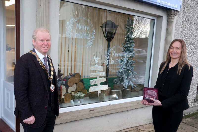 Kerr Insurance Group was the winner of the Best Christmas Window in Kilrea. Deputy Mayor of Causeway Coast and Glens Borough Council Alderman Tom McKeown presented the prize to Office Manager Bernie Downey.