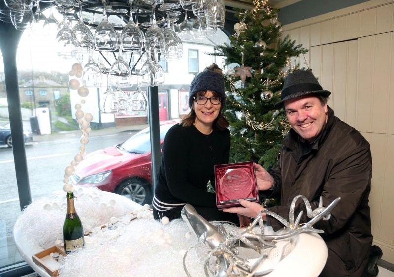 The French rooms on Main Street Bushmills was the winner of Causeway Coast and Glens Borough Council’s Christmas window competition in Bushmills. Stella Bolton is pictured receiving the award from Town and Village Officer Shaun Kennedy.