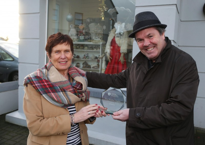 St. Vincent de Paul charity shop on Maghera Street Kilrea was the winner of Causeway Coast and Glens Borough Council’s Christmas window competition in Kilrea. Eileen McShane is pictured receiving the award from Town and Village Officer Shaun Kennedy.