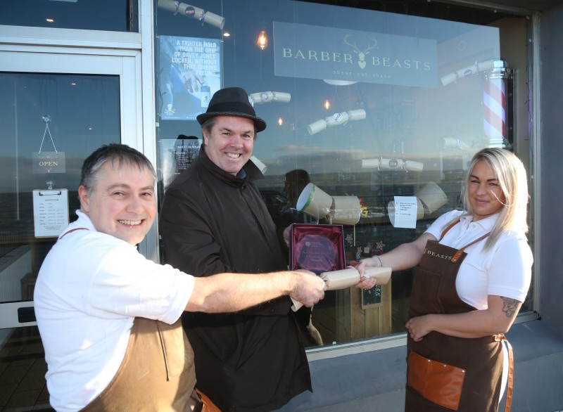 Barber Beasts on The Promenade Portstewart was the winner of Causeway Coast and Glens Borough Council’s Christmas window competition in Portstewart. Keith Stynes and Chloe Reeve are pictured receiving the award from Town and Village Officer Shaun Kennedy.